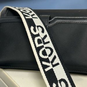 Cross body purse with logo strap